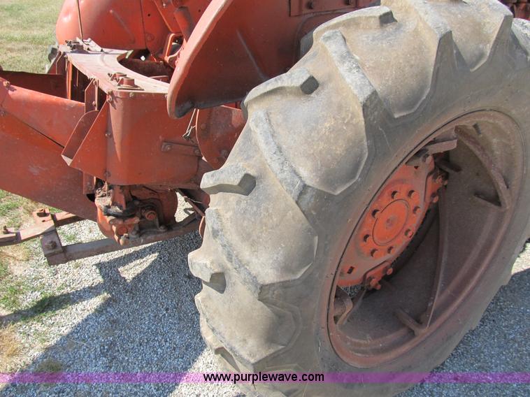 image for item B2765 1950 Allis-Chalmers WD tractor with mounted corn picker