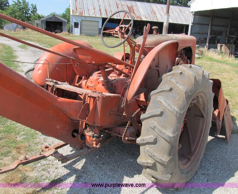 image for item B2765 1950 Allis-Chalmers WD tractor with mounted corn picker