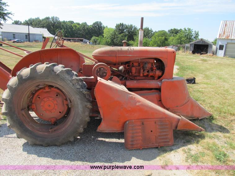 image for item B2765 1950 Allis-Chalmers WD tractor with mounted corn picker
