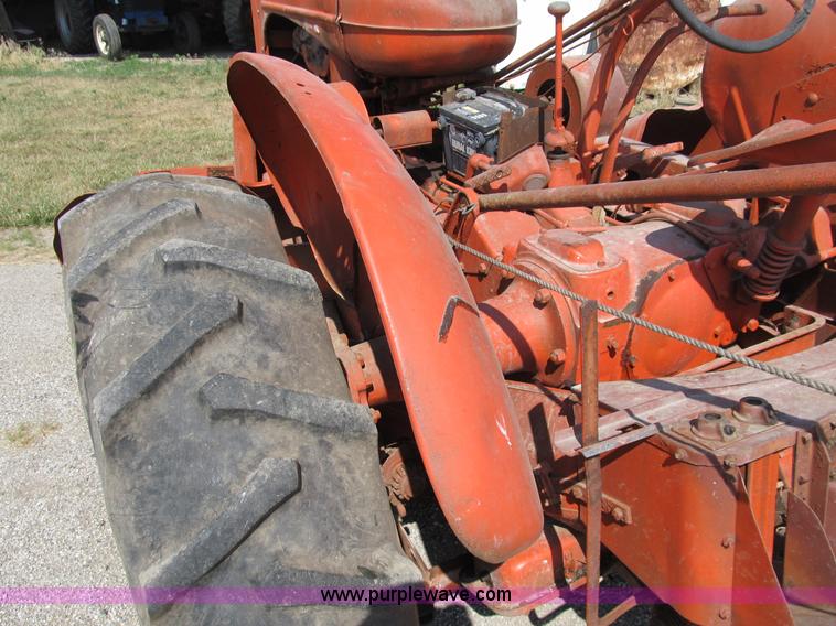 image for item B2765 1950 Allis-Chalmers WD tractor with mounted corn picker
