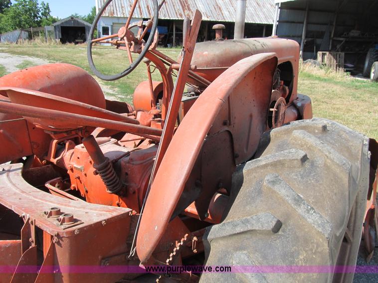 image for item B2765 1950 Allis-Chalmers WD tractor with mounted corn picker