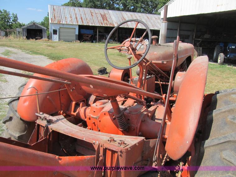 image for item B2765 1950 Allis-Chalmers WD tractor with mounted corn picker