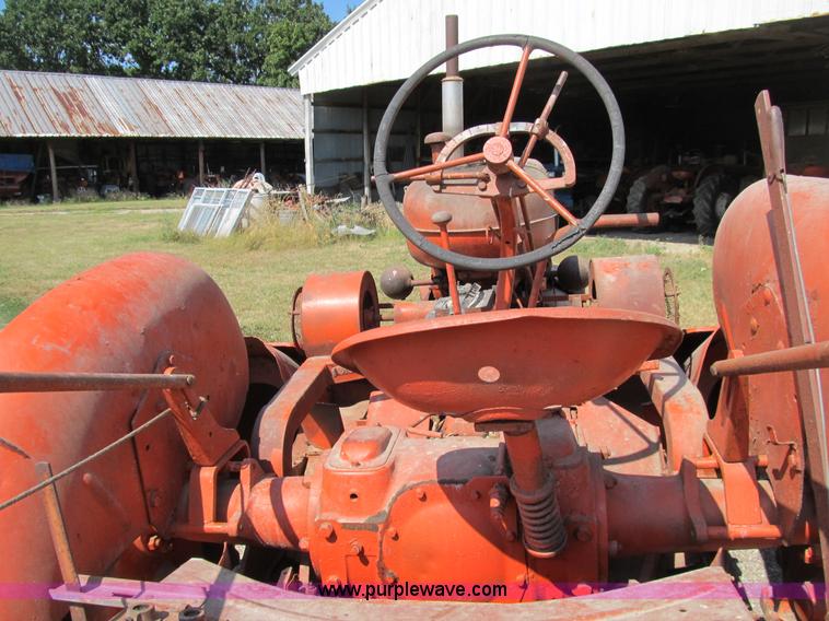 image for item B2765 1950 Allis-Chalmers WD tractor with mounted corn picker
