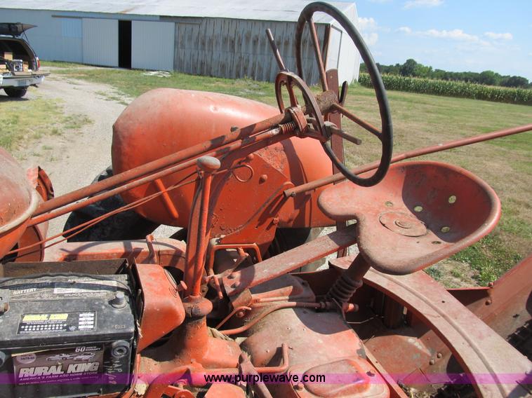 image for item B2765 1950 Allis-Chalmers WD tractor with mounted corn picker
