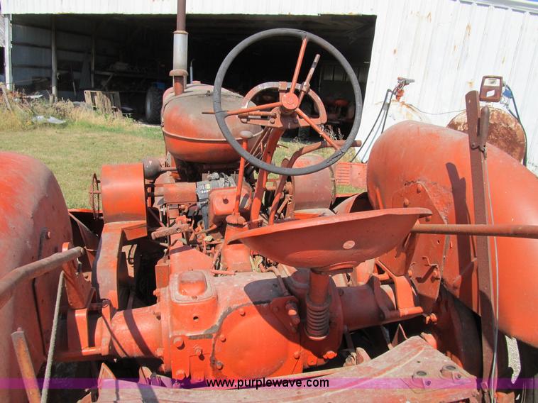 image for item B2765 1950 Allis-Chalmers WD tractor with mounted corn picker