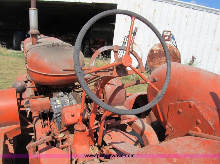 image for item B2765 1950 Allis-Chalmers WD tractor with mounted corn picker