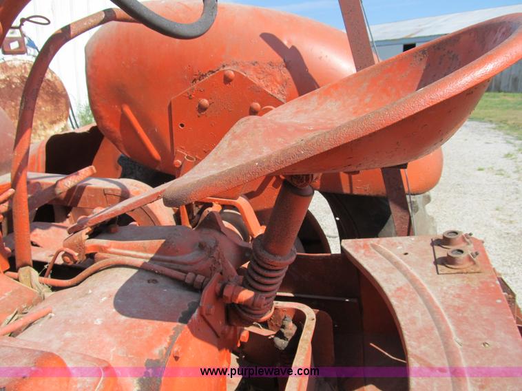 image for item B2765 1950 Allis-Chalmers WD tractor with mounted corn picker