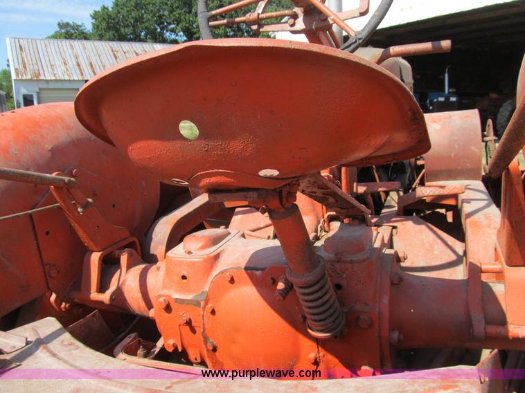 image for item B2765 1950 Allis-Chalmers WD tractor with mounted corn picker