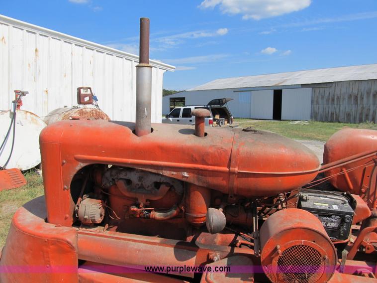 image for item B2765 1950 Allis-Chalmers WD tractor with mounted corn picker