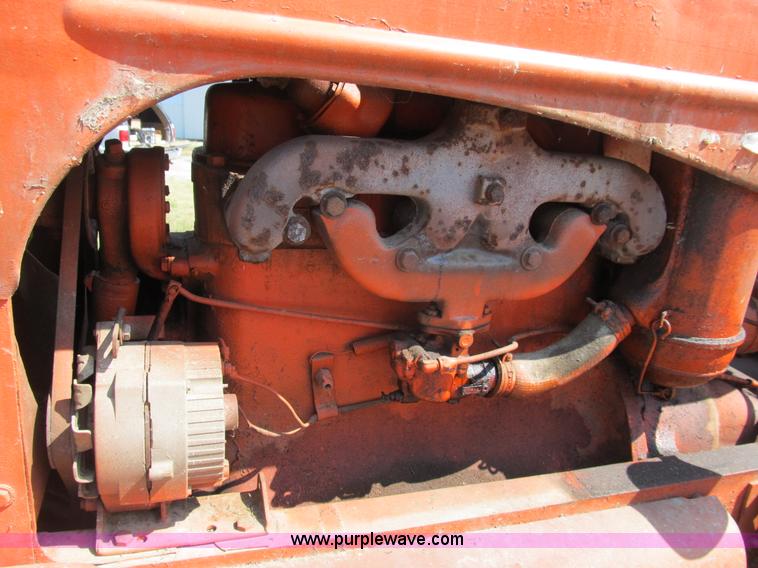 image for item B2765 1950 Allis-Chalmers WD tractor with mounted corn picker