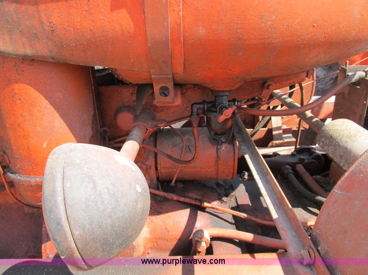 image for item B2765 1950 Allis-Chalmers WD tractor with mounted corn picker