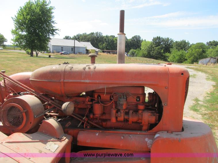 image for item B2765 1950 Allis-Chalmers WD tractor with mounted corn picker