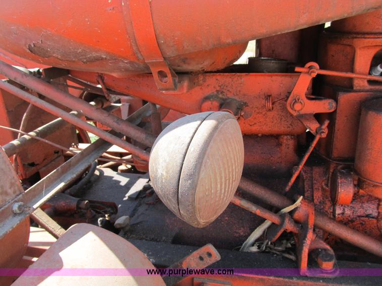 image for item B2765 1950 Allis-Chalmers WD tractor with mounted corn picker