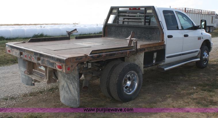 image for item B6867 2007 Dodge Ram 3500 HD quad cab flatbed pickup truck