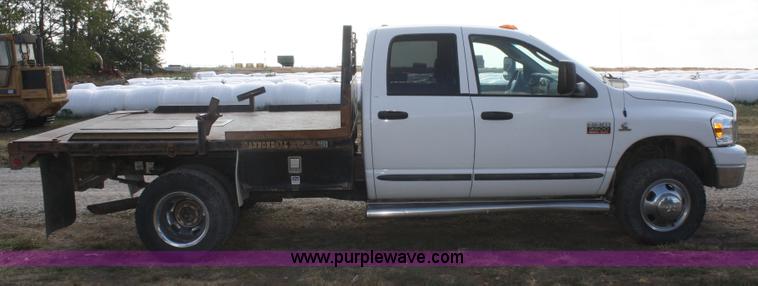 image for item B6867 2007 Dodge Ram 3500 HD quad cab flatbed pickup truck