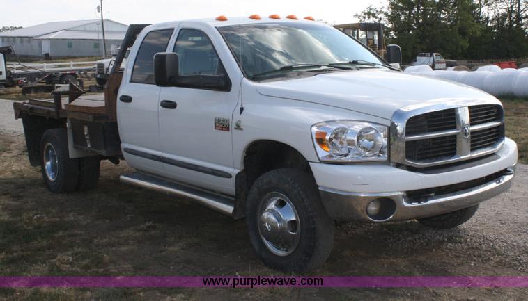 image for item B6867 2007 Dodge Ram 3500 HD quad cab flatbed pickup truck