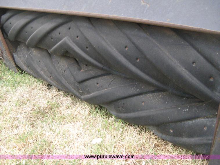 image for item B8041 New Holland self propelled swather crimper attachment