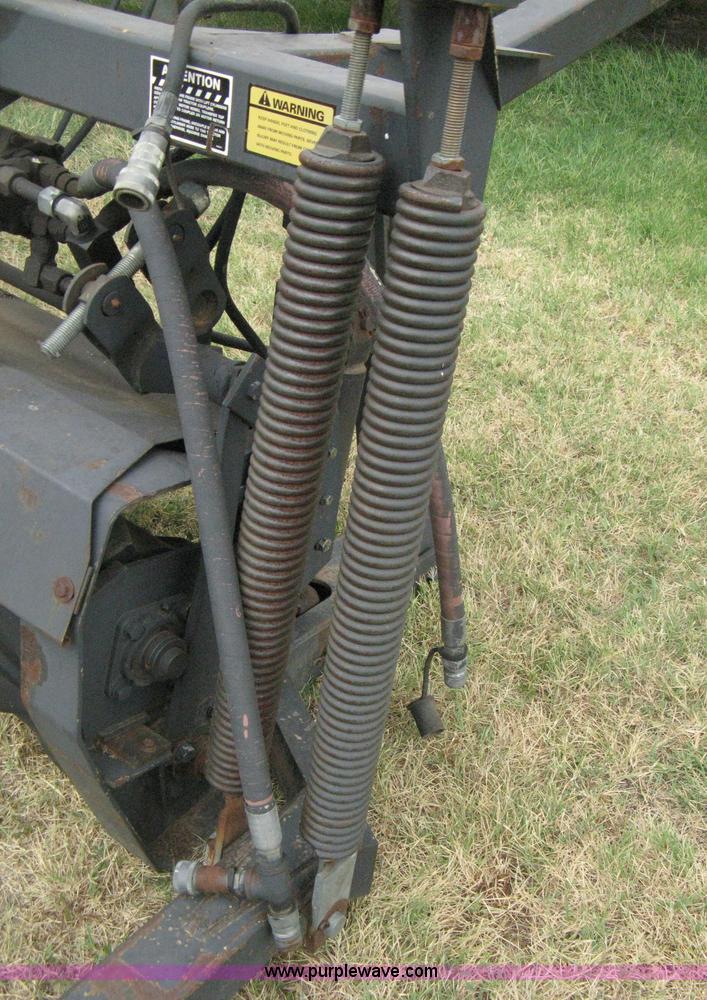 image for item B8041 New Holland self propelled swather crimper attachment