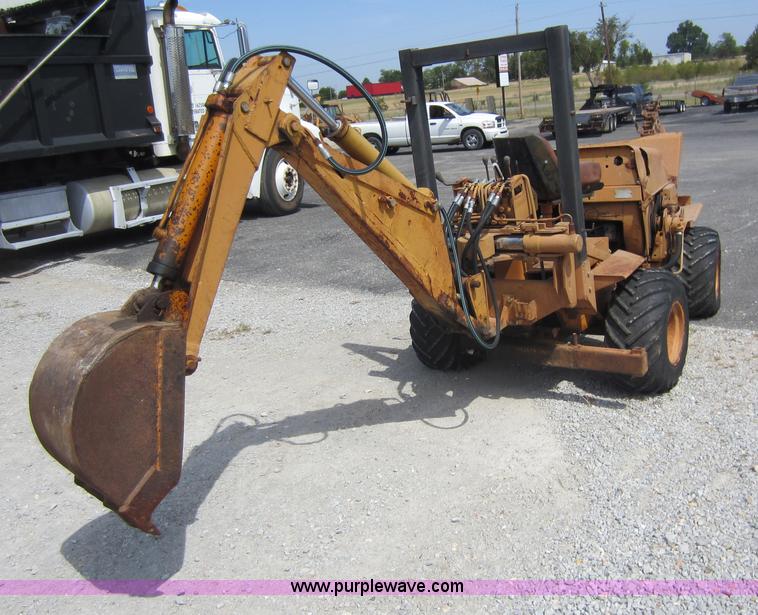 image for item D5595 Case Davis 1448 trencher with backhoe attachment
