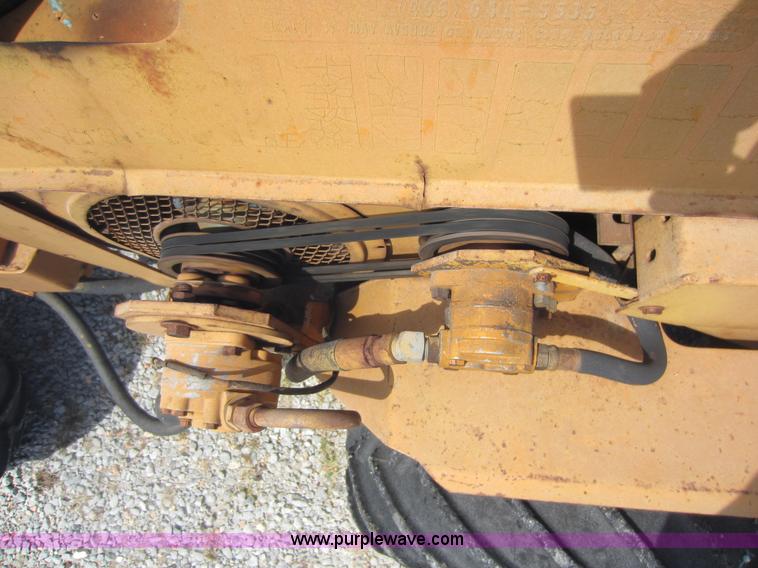 image for item D5595 Case Davis 1448 trencher with backhoe attachment