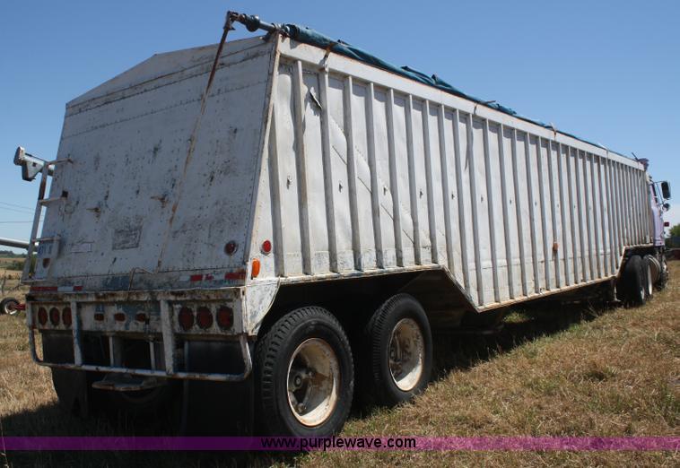 image for item D4499 1974 Cornhusker double hopper grain trailer