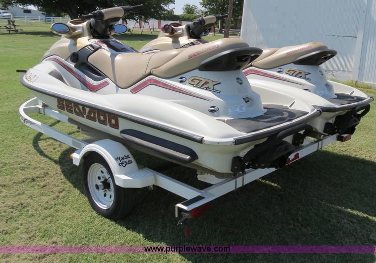 image for item B2391 (2) 1999 Bombardier GTX RFI Sea-Doo jet skis with trailer