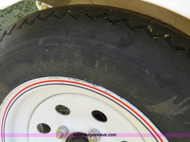 image for item B2391 (2) 1999 Bombardier GTX RFI Sea-Doo jet skis with trailer