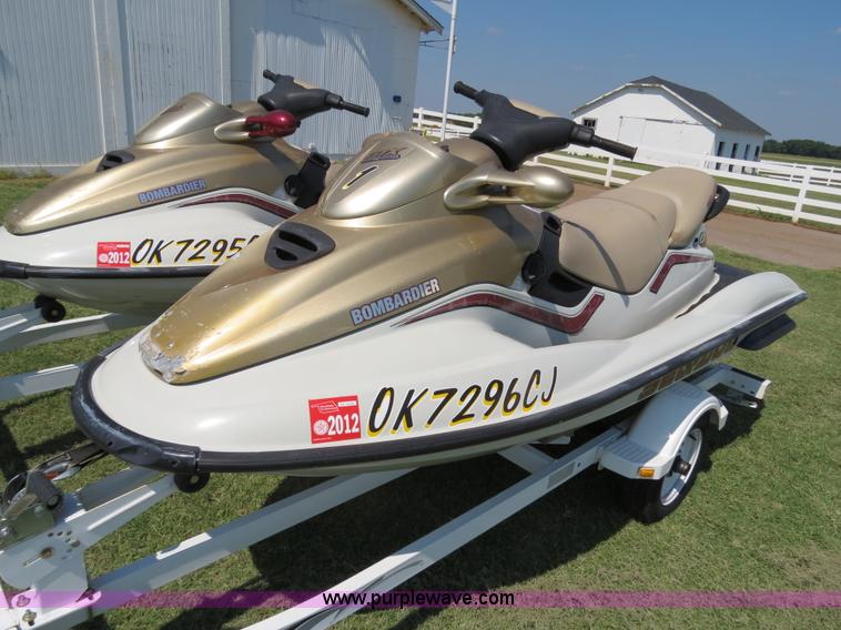 image for item B2391 (2) 1999 Bombardier GTX RFI Sea-Doo jet skis with trailer