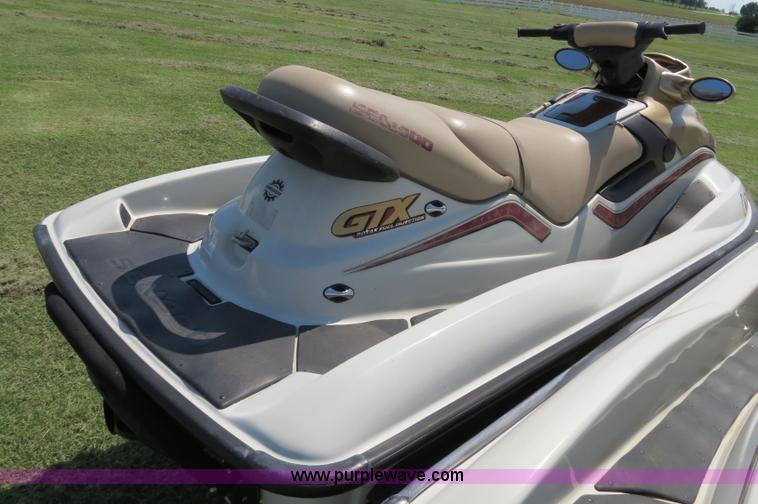 image for item B2391 (2) 1999 Bombardier GTX RFI Sea-Doo jet skis with trailer