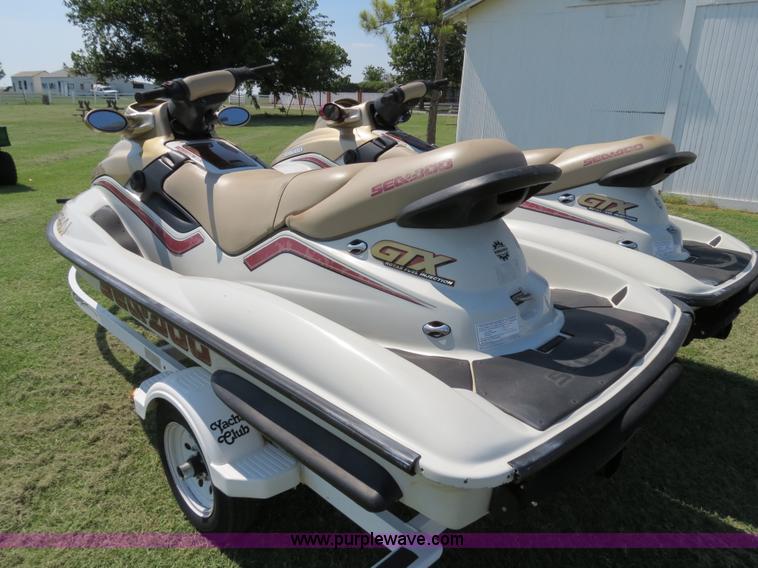 image for item B2391 (2) 1999 Bombardier GTX RFI Sea-Doo jet skis with trailer
