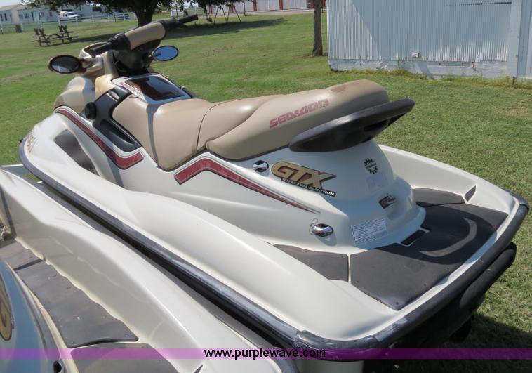 image for item B2391 (2) 1999 Bombardier GTX RFI Sea-Doo jet skis with trailer