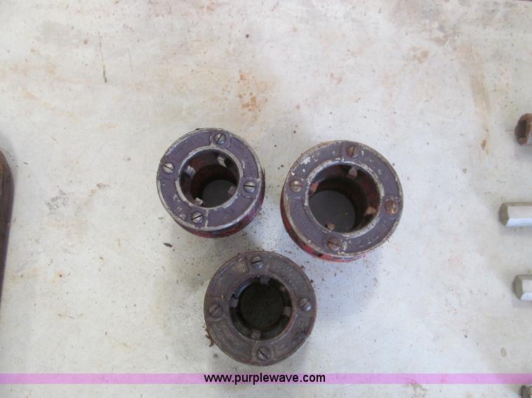 image for item F4523 Assorted large wrenches, sockets, Allen wrenches, and threading equipment