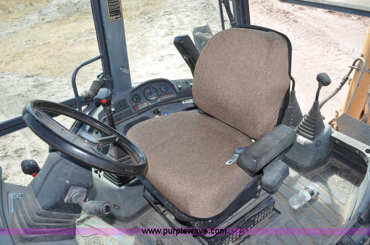 image for item A5959 New Holland 555E backhoe