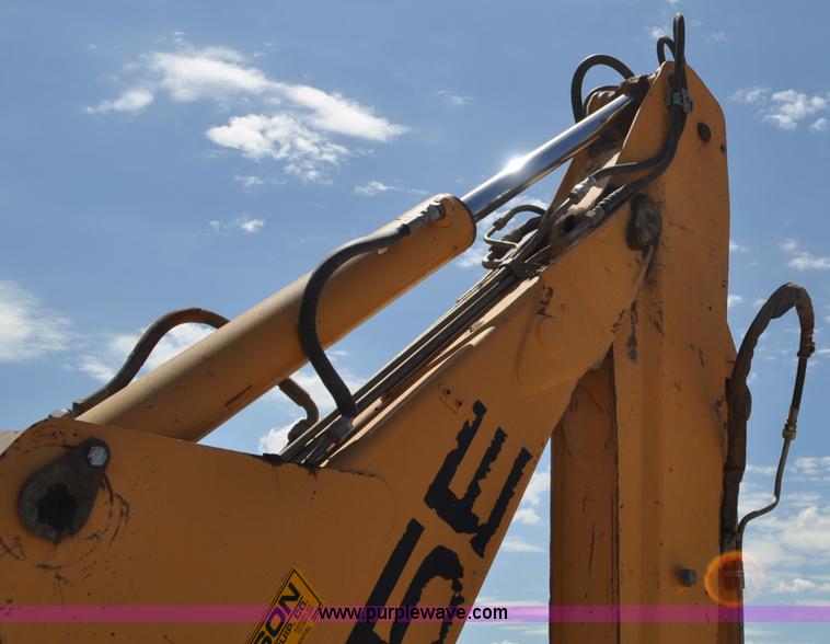 image for item A5959 New Holland 555E backhoe