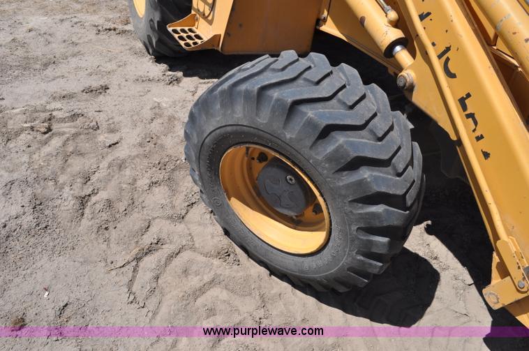 image for item A5959 New Holland 555E backhoe