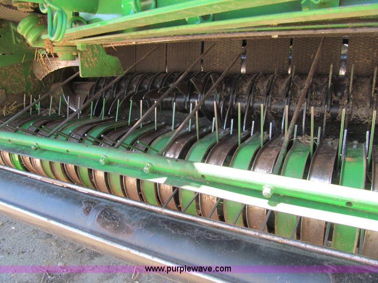 image for item F5504 2009 John Deere 568 round baler