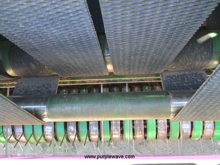 image for item F5504 2009 John Deere 568 round baler