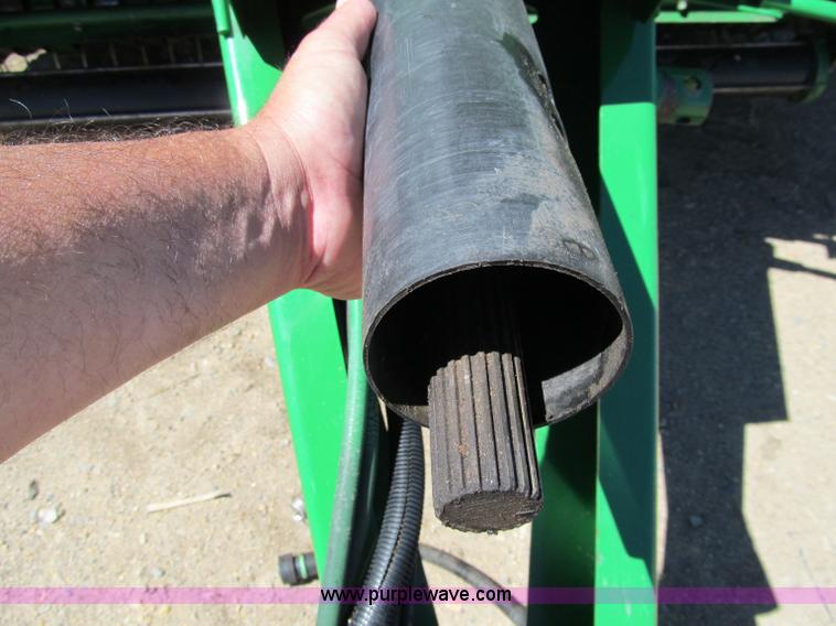 image for item F5504 2009 John Deere 568 round baler