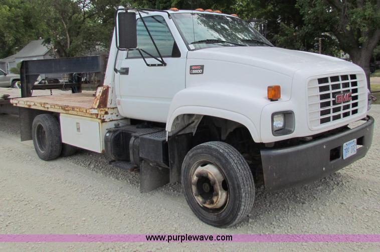 image for item B7370 1999 GMC C5500 flatbed truck