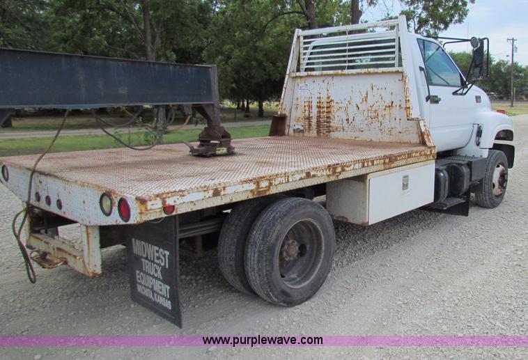 image for item B7370 1999 GMC C5500 flatbed truck