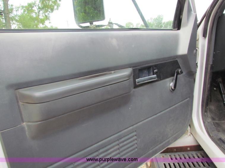 image for item B7370 1999 GMC C5500 flatbed truck