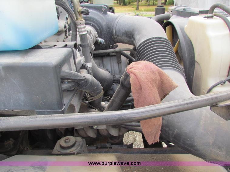 image for item B7370 1999 GMC C5500 flatbed truck