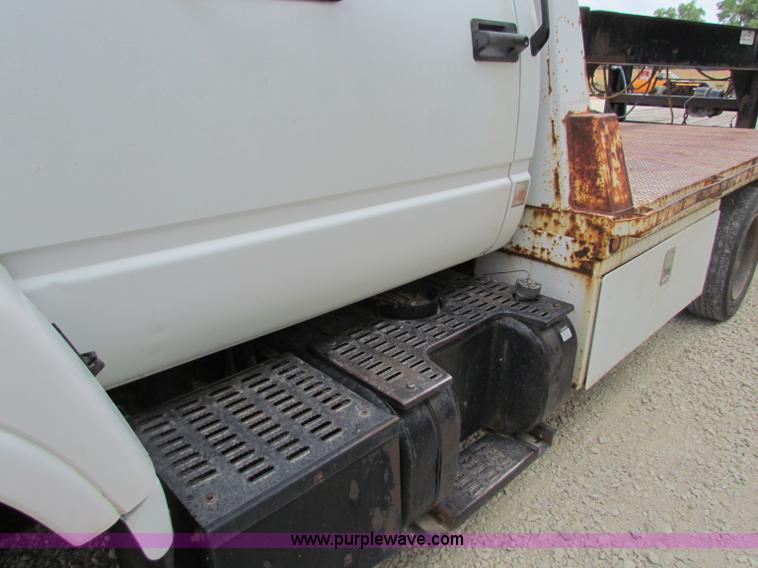 image for item B7370 1999 GMC C5500 flatbed truck