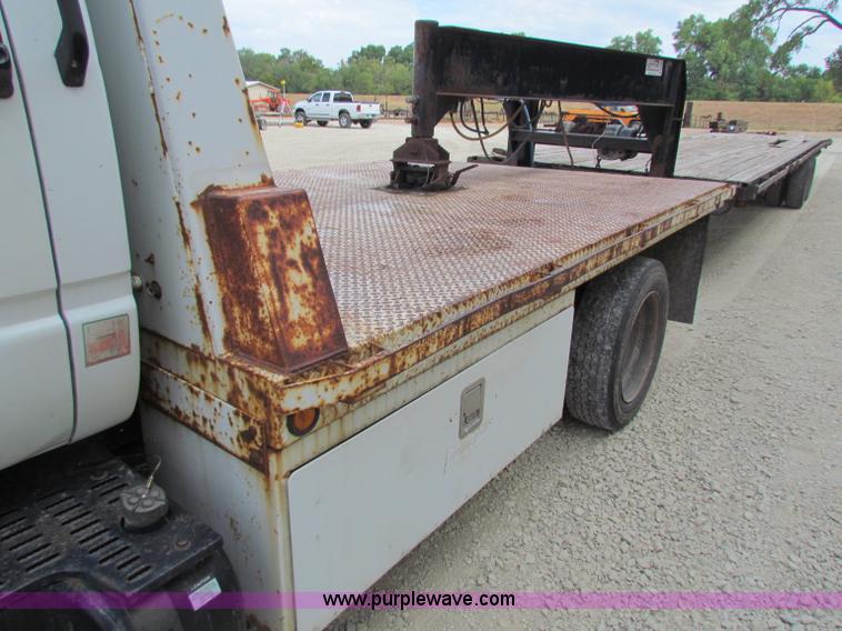 image for item B7370 1999 GMC C5500 flatbed truck