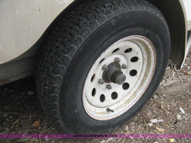 image for item B8033 2004 H & H tandem axle cargo trailer