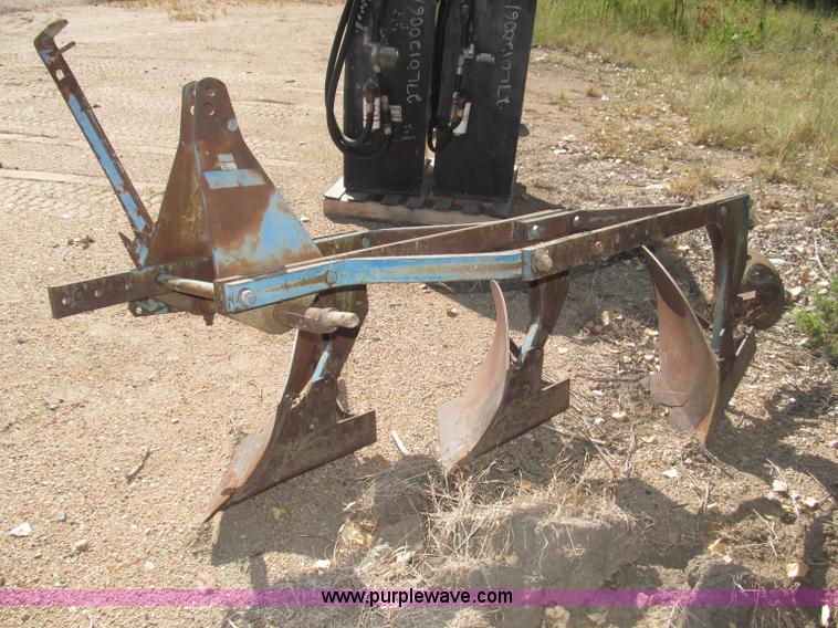 image for item K9564 Ford three bottom plow