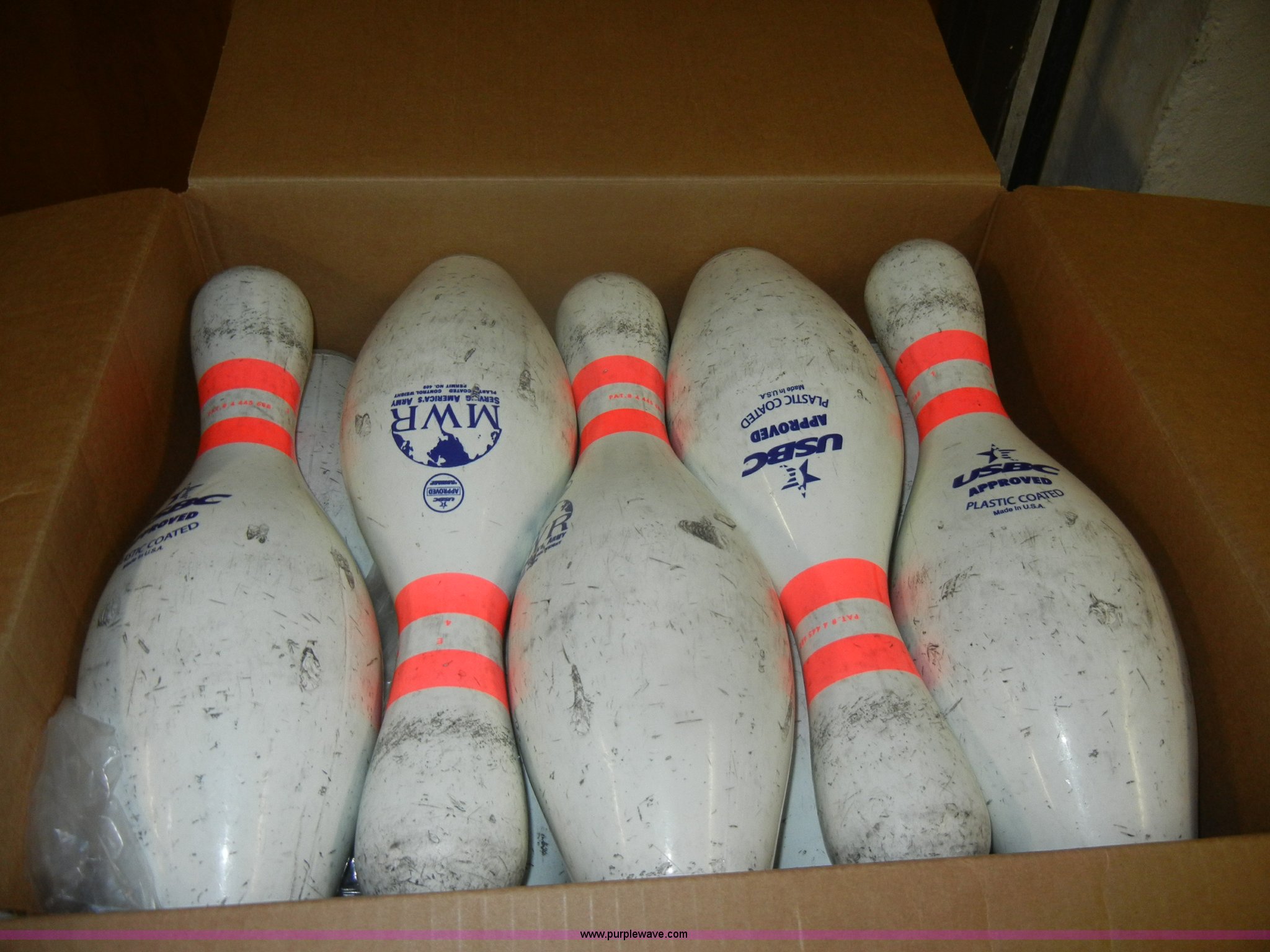Approximately 78 cases of used Amflite II bowling pins in Fort Riley