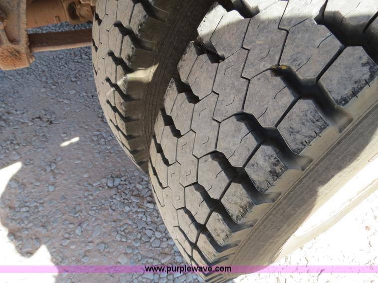 image for item B2457 1997 International 4700 winch truck