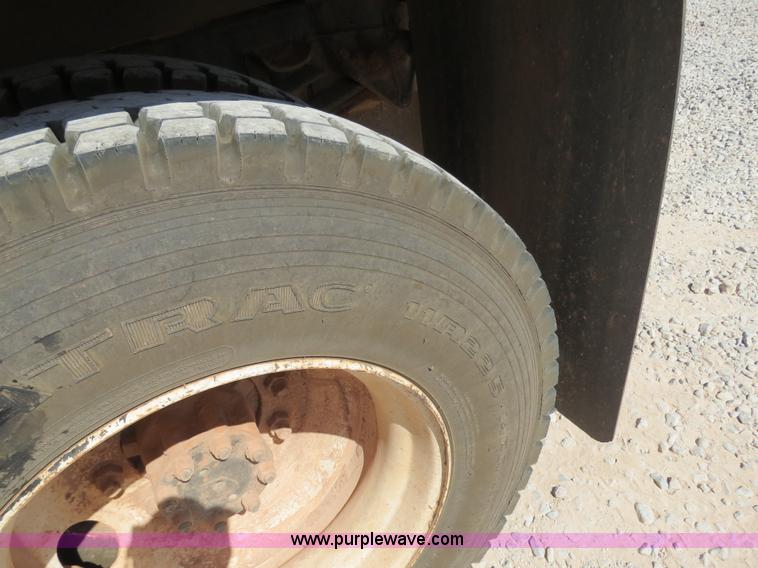 image for item B2457 1997 International 4700 winch truck