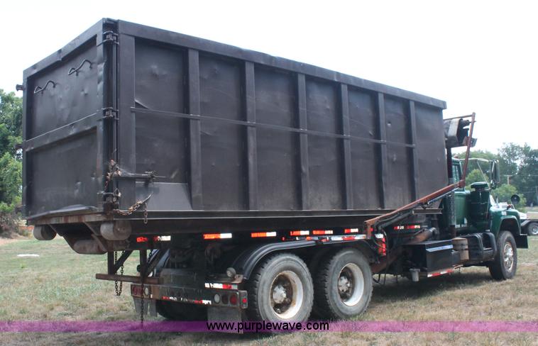 image for item C2737 1985 Mack DM685S roll off truck